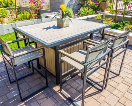 Modern outdoor patio dining set with six chairs around table - Turnkey Outdoor Designs