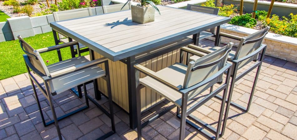 Modern outdoor patio dining set with six chairs around table - Turnkey Outdoor Designs
