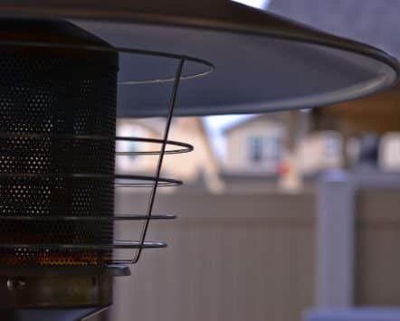 Outdoor patio heater warming a residential backyard patio