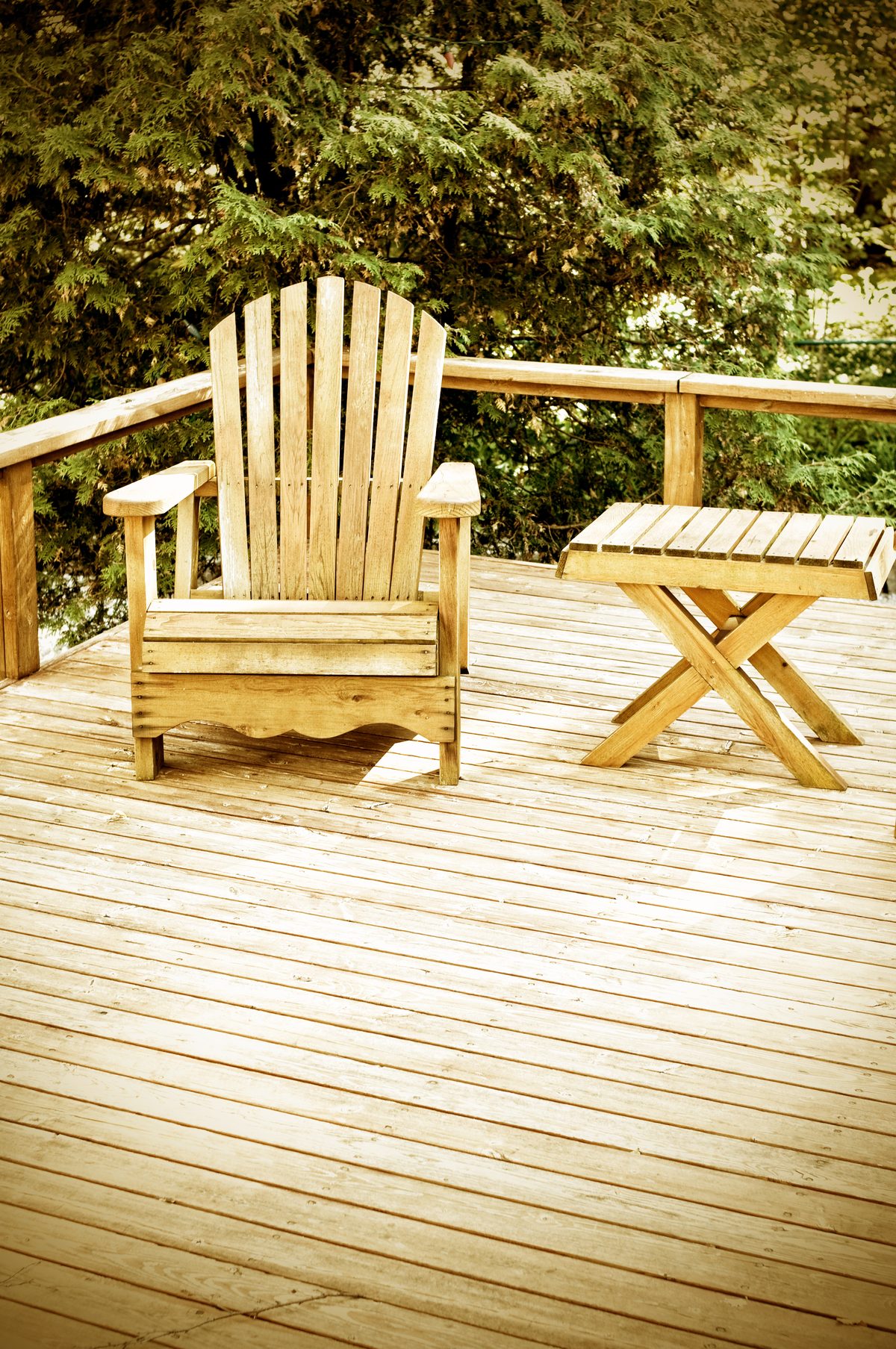 Adirondack chair and a side table on a timber deck